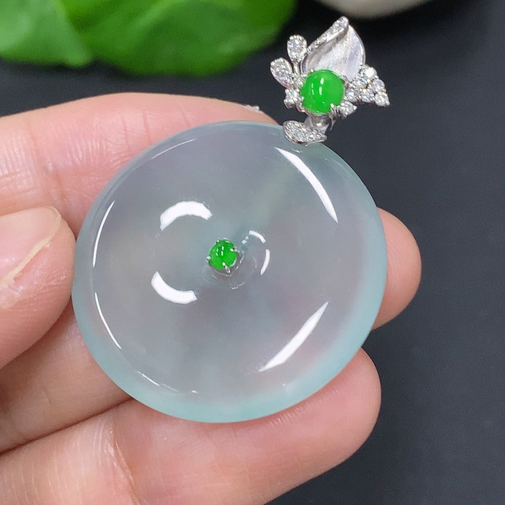 Jadeite pendant with peace button design, 18k gold accents, and diamond details, weighing approximately 10.6 grams.