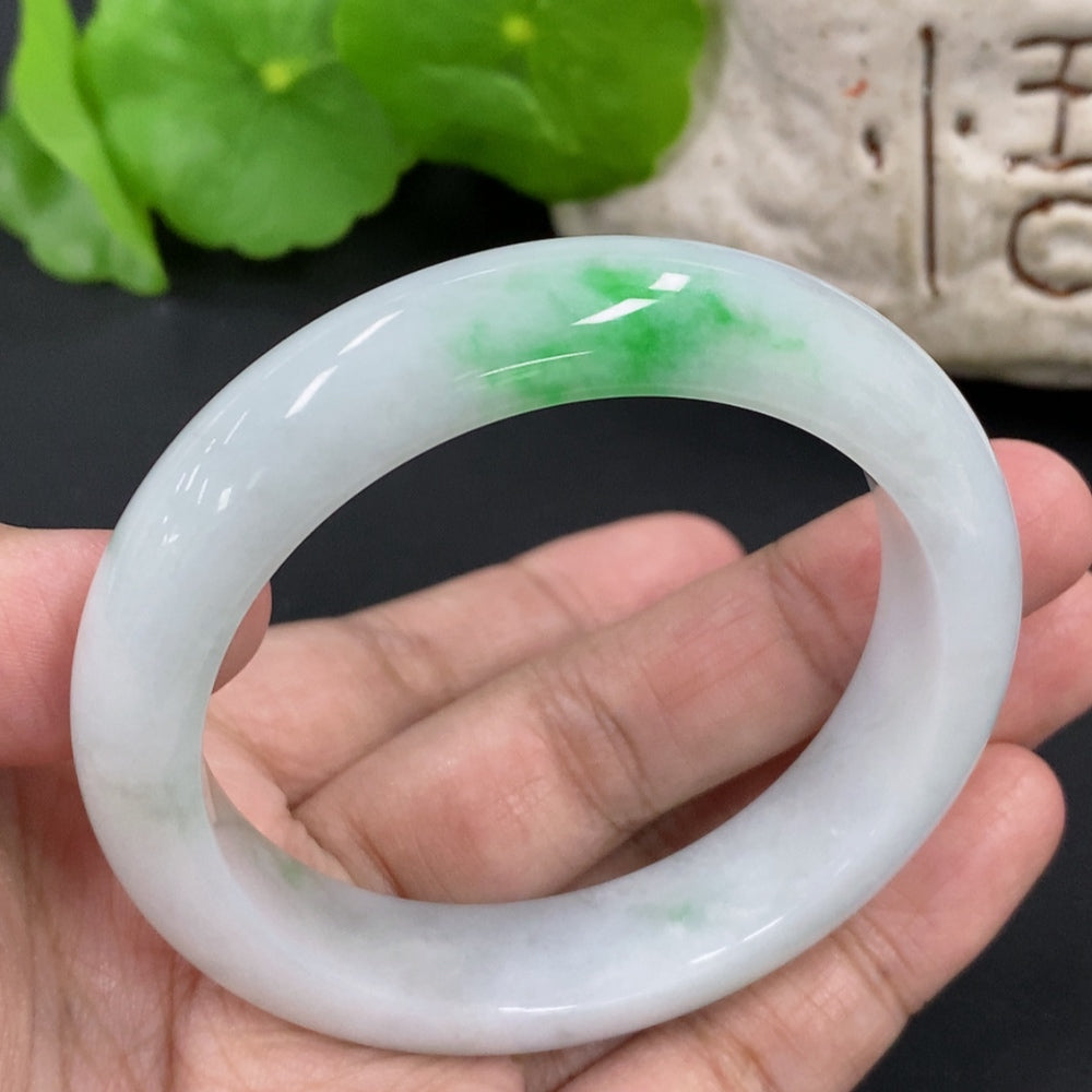HKHQ jadeite round bangle, size 52.7, weighing 53.25g, showcasing smooth, polished green jadeite bracelet on a neutral background.