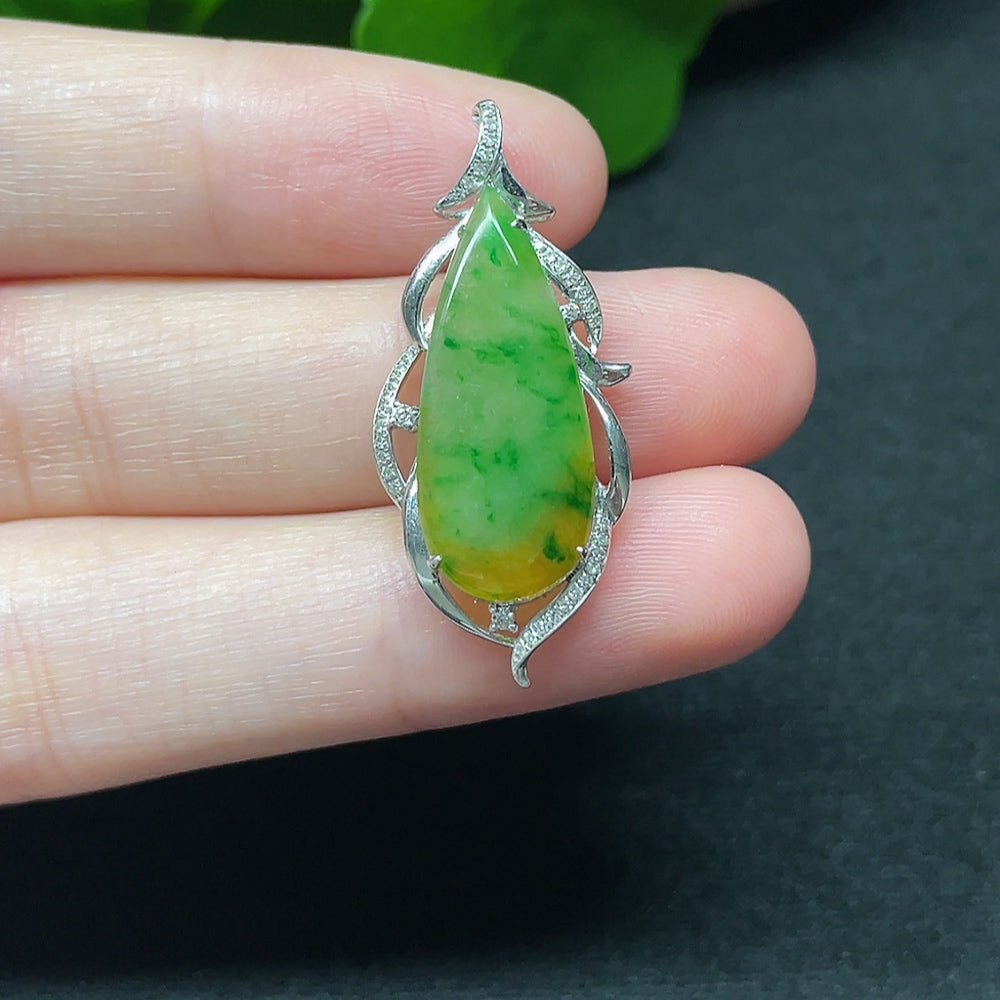 Jadeite teardrop pendant with 18K gold setting and diamond accents, elegant necklace by HKHQ displayed against a neutral background.