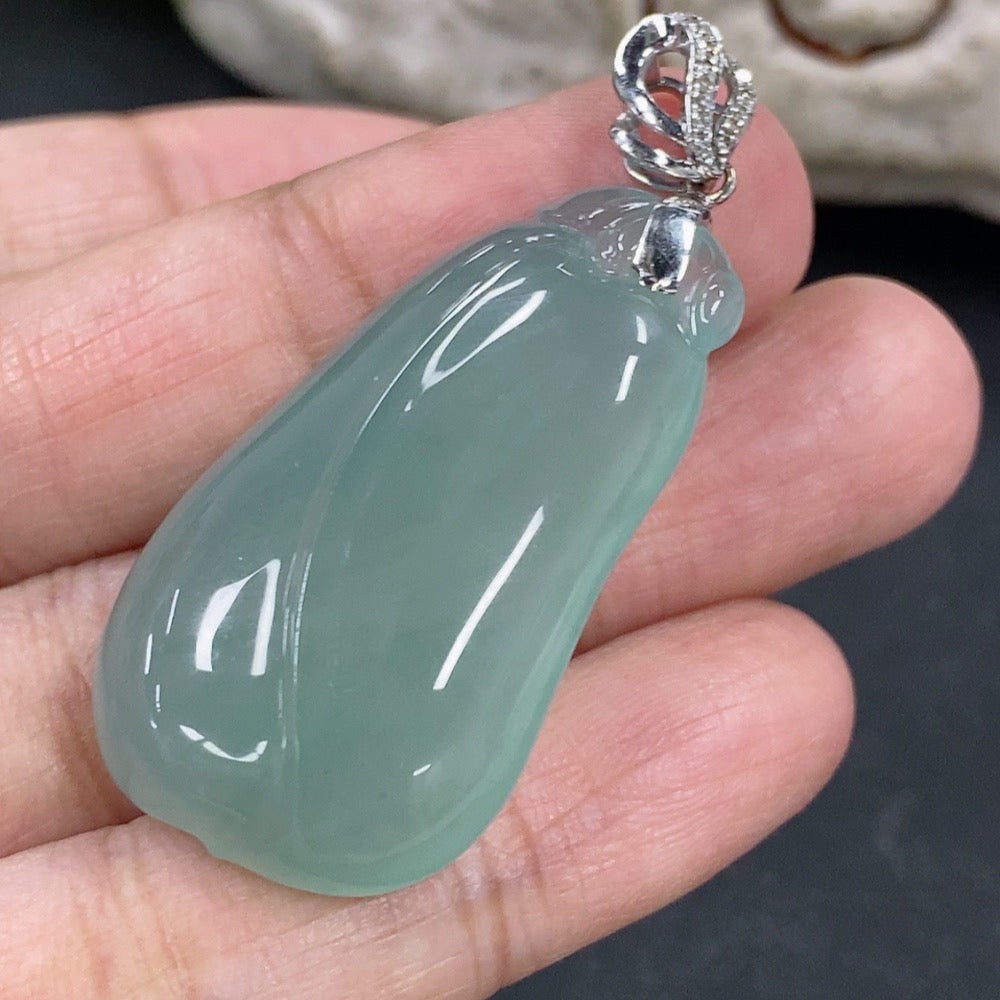 Jadeite pendant featuring a blessing melon design with 18K gold and diamond accents, crafted by HKHQ, displayed on a chain.