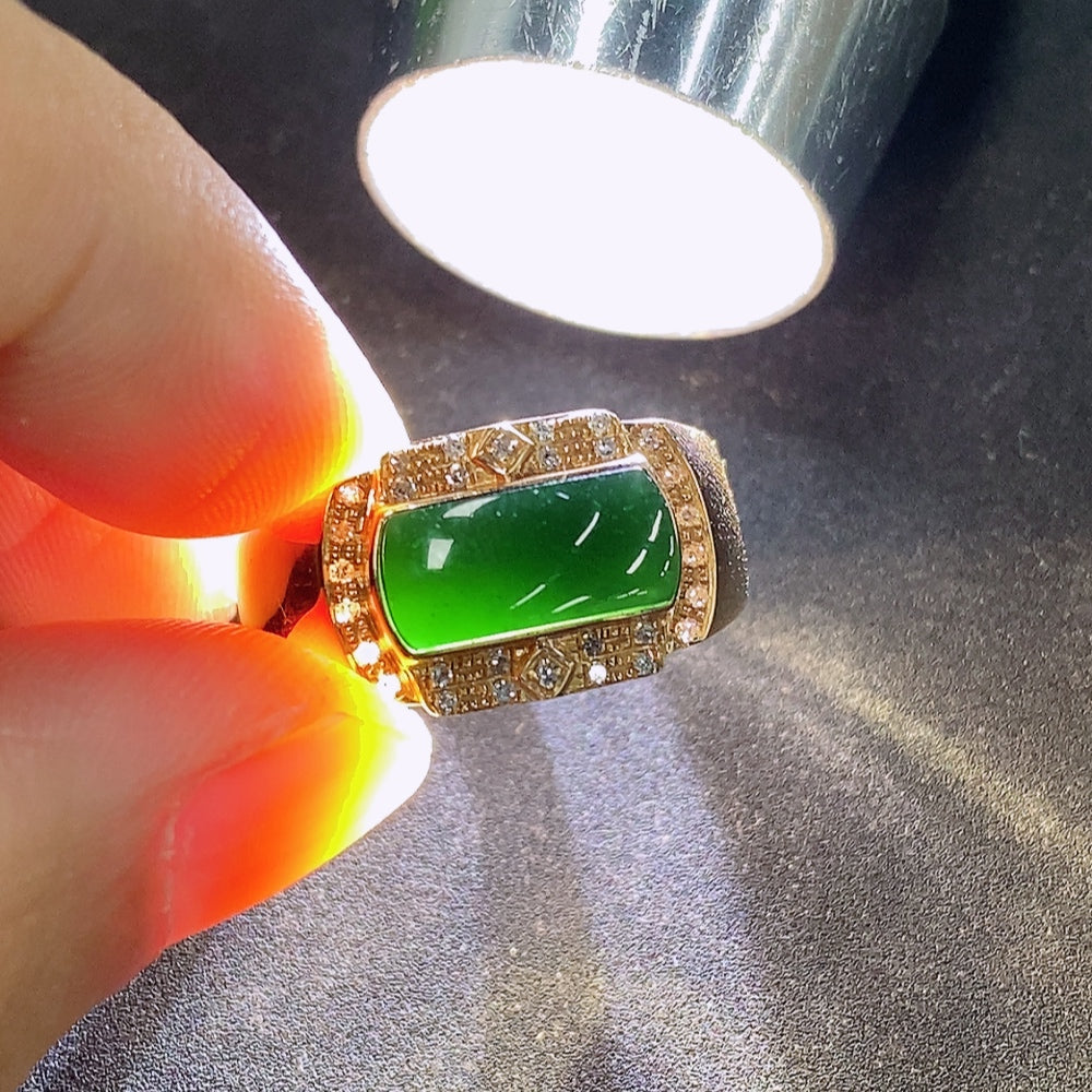 Elegant jadeite and diamond ring in 18K gold featuring intricate design, showcasing the luxurious gemstone setting.