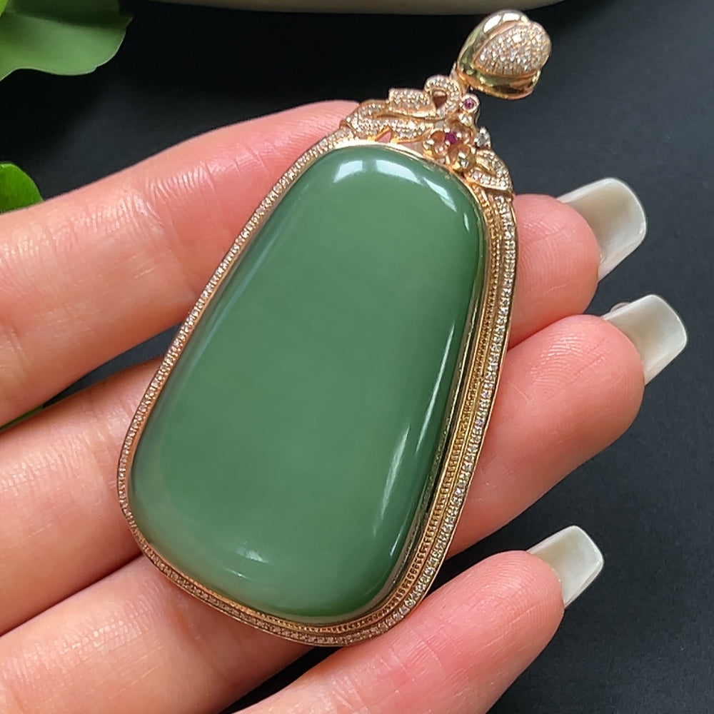 Hetian Jade plain pendant with 18K gold and diamond inlay, displayed as part of a necklace, showcasing elegant jewelry craftsmanship.