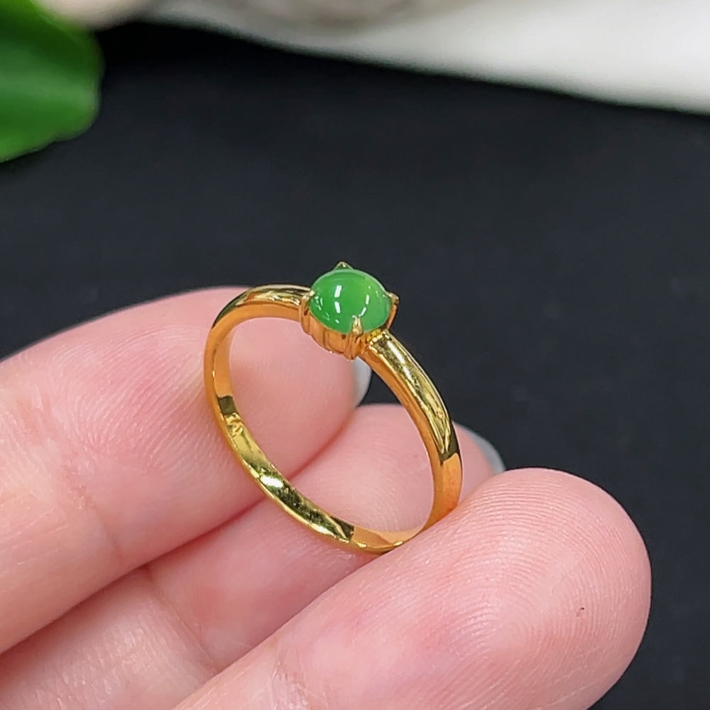 Elegant jadeite inlaid ring with 18K gold band from HKHQ, showcasing intricate craftsmanship and vibrant green jade details.