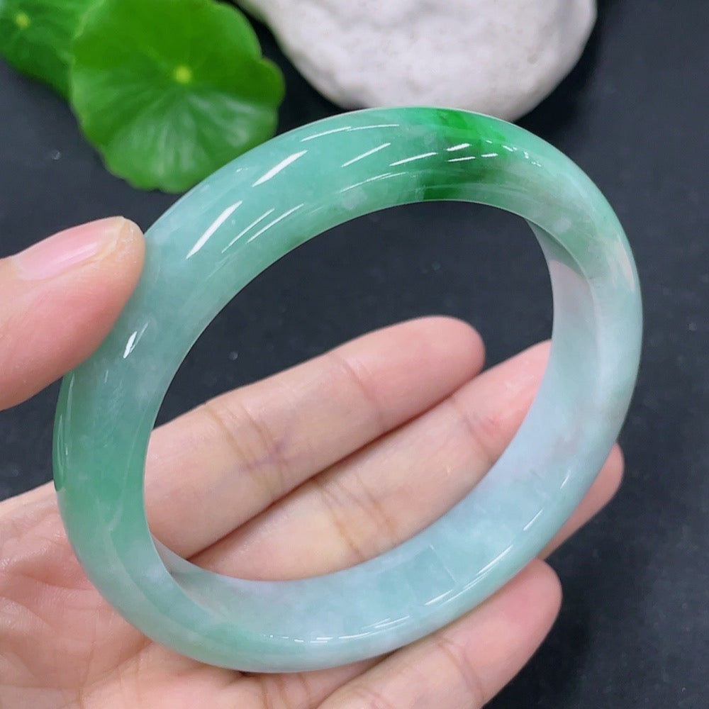 HKHQ jadeite round bangle with 57.5mm diameter, weighing approximately 56.35g, showcasing smooth, polished jade surface.