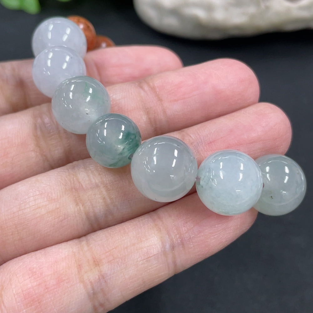 Jadeite and wood bead bracelet with 12.2mm beads, weighing 23.8g, featuring natural jade and wooden accents.