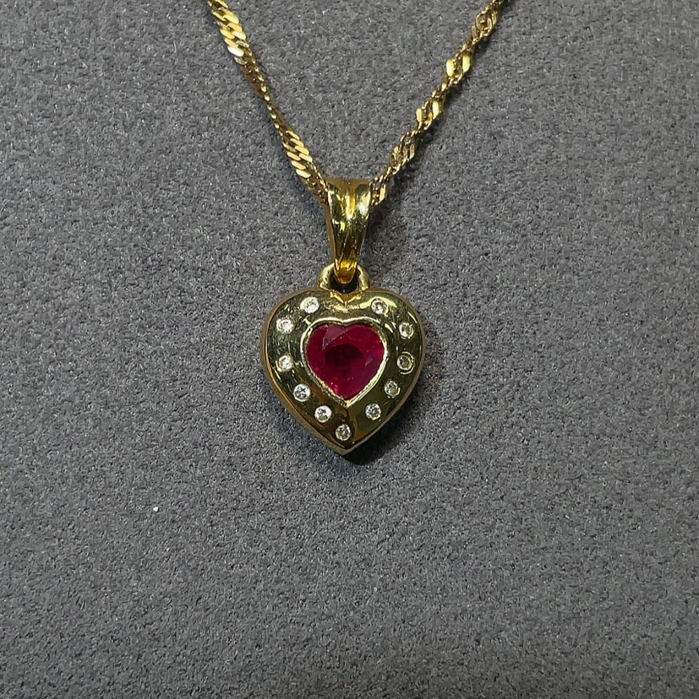 18K gold ruby pendant with diamond accents, total weight including chain approximately 4.14g