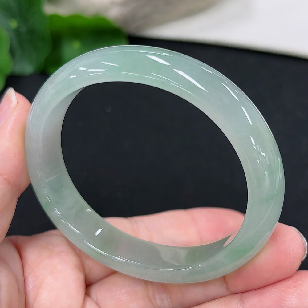 HKHQ jadeite concubine bracelet with carved details, 56.2/48.4 size, weighing approximately 41.1g, showcasing intricate jade craftsmanship.