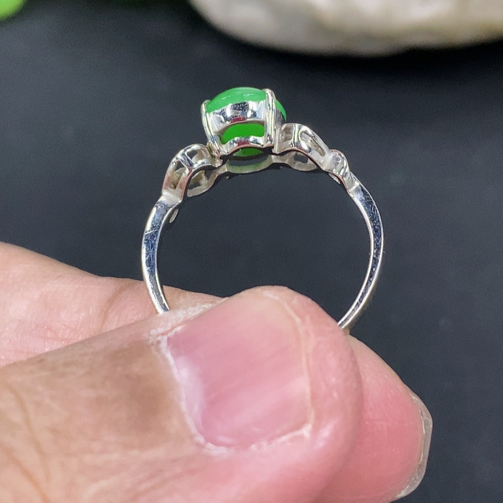 Jadeite cabochon ring with 18k gold setting, size 11.5, crafted by HKHQ, with a smooth green jade stone and gold band.