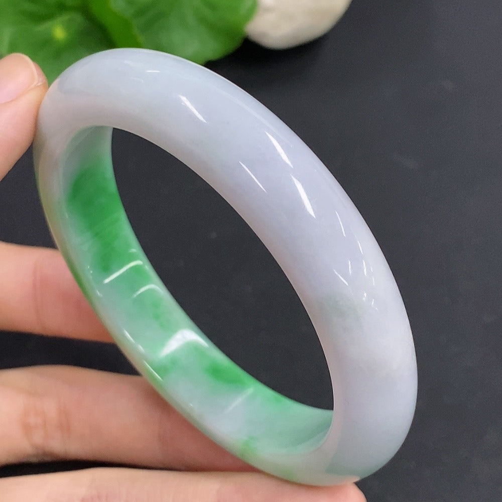 HKHQ jadeite round bangle, 60.6g weight, size 57.3, smooth polished bracelet showcasing vibrant green jadeite.