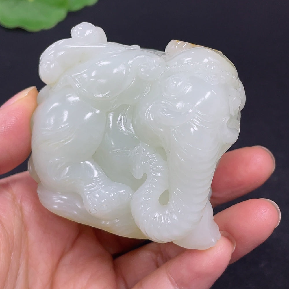 Handheld Hetian Jade carving titled "Attaining High Rank and Position" by HKHQ, showcasing detailed jade craftsmanship.