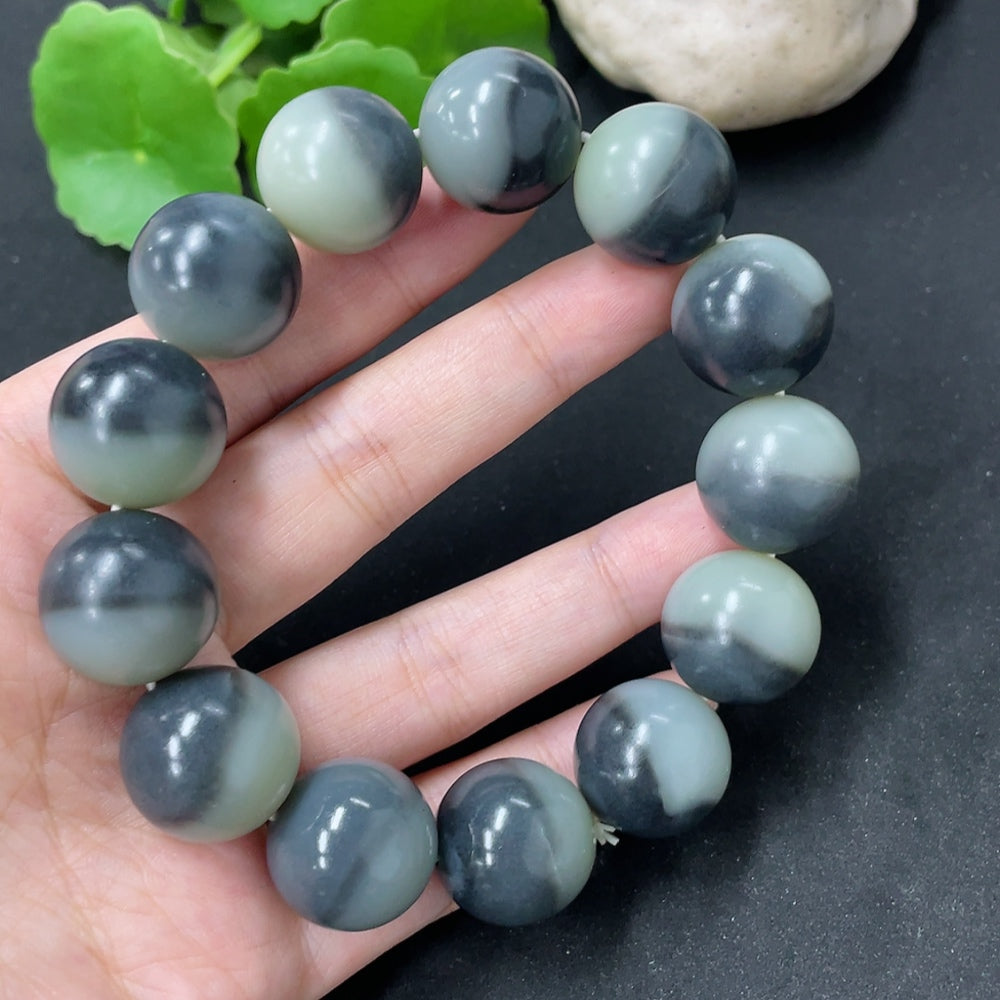 HKHQ Hetian Jade bracelet with 17.8mm beads, approximately 114.9g, showcasing smooth, polished green jade stones.