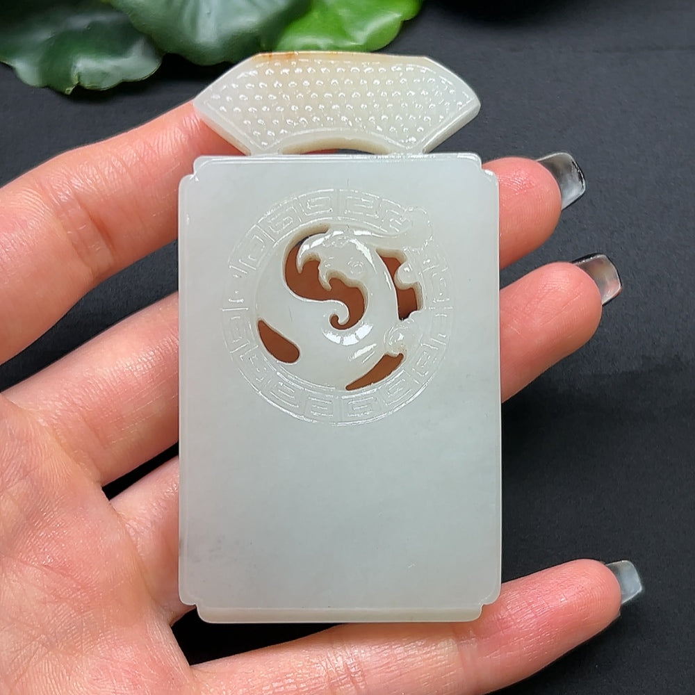 Close-up of a HKHQ Hetian Jade Chinese Dream Ornament showcasing smooth, polished jade with intricate carvings.