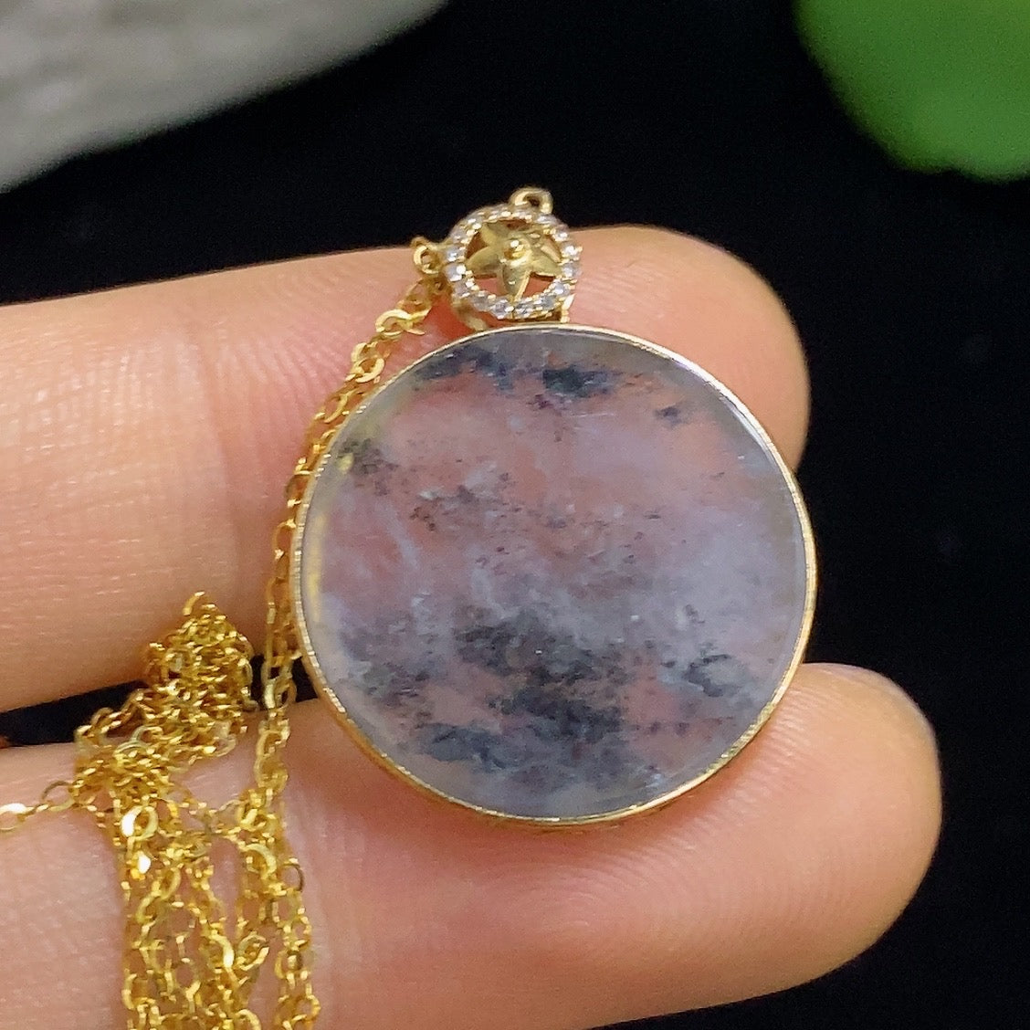 Jadeite plain pendant with 18k gold and diamond inlay, HKHQ jade jewelry, showing the pendant's smooth jade surface and gold setting