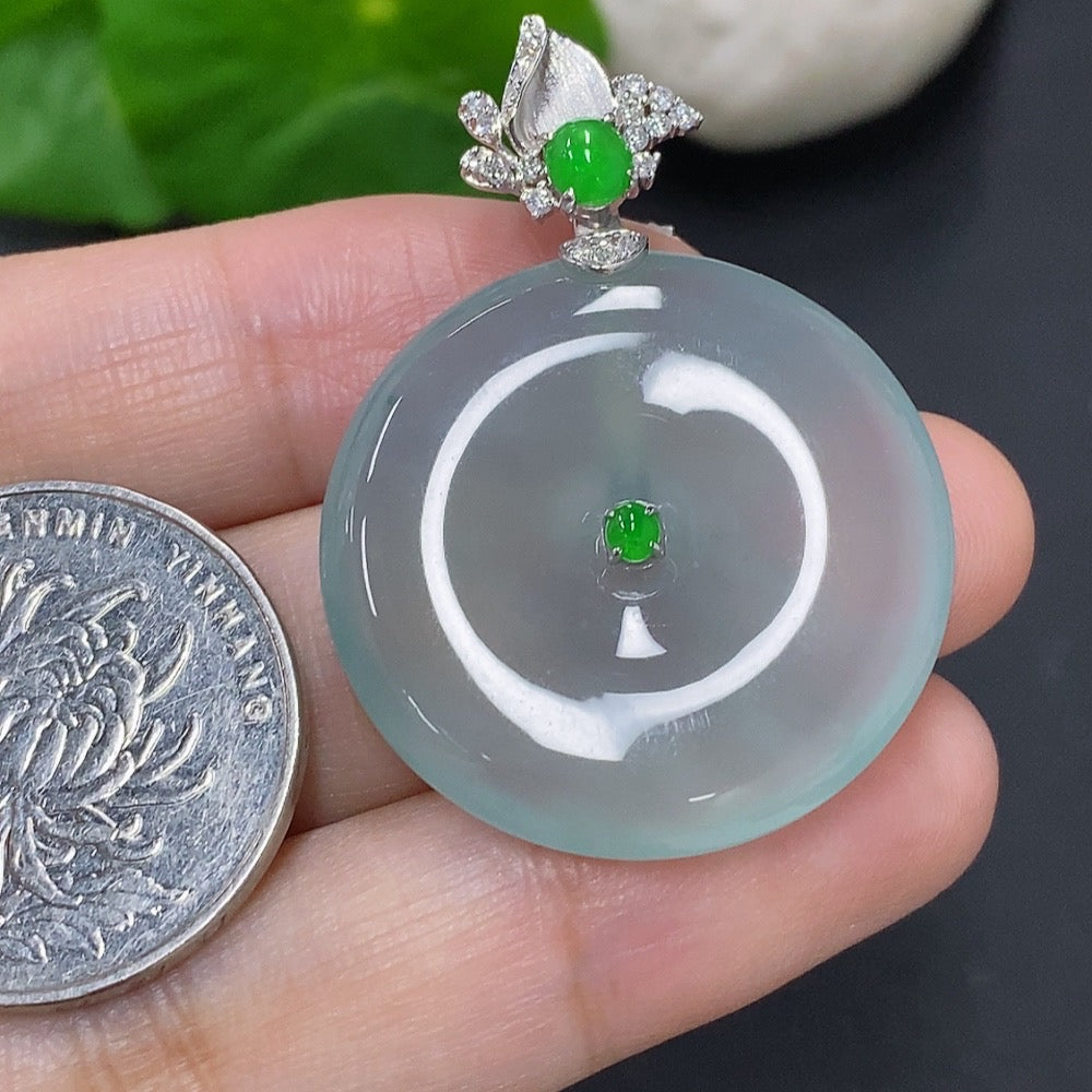 Jadeite pendant with peace button design, 18k gold accents, and diamond details, weighing approximately 10.6 grams.