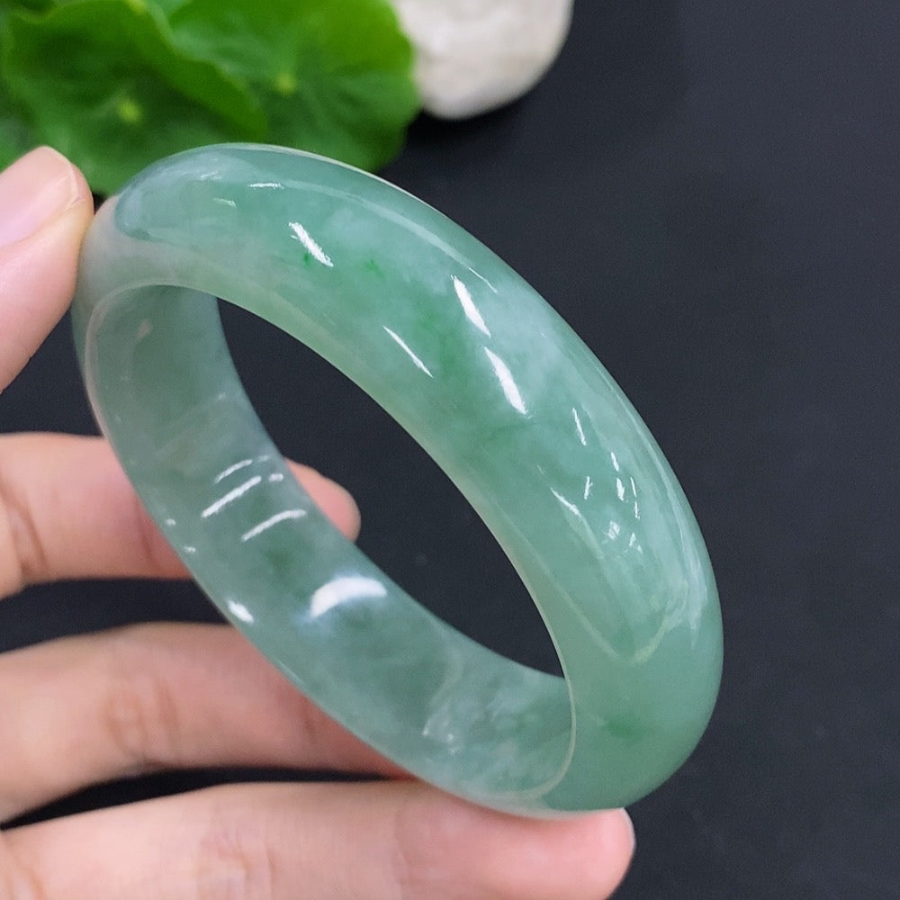 Jadeite round bangle in jade, weight approximately 65.9g, size 55.5, from HKHQ, showcasing smooth, polished surface.