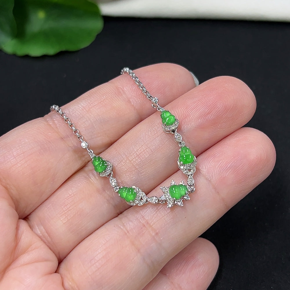 Jadeite gourd inlaid bracelet by HKHQ with 18k gold and diamond accents, showcasing intricate craftsmanship and elegant design.