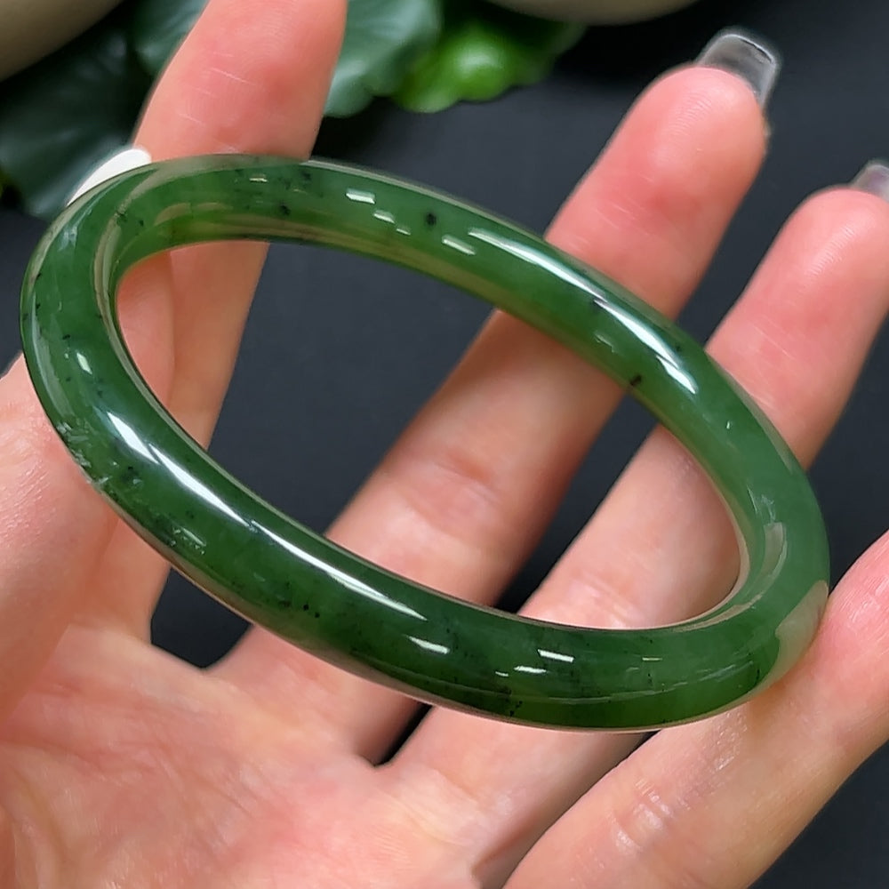 HKHQ Hetian Jade round bangle, 56.7mm, weighs 29.59g, showcasing smooth, polished jade with natural green hues.