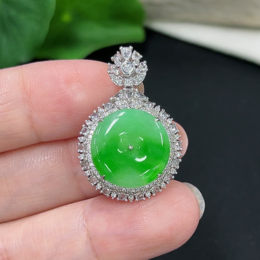 Jadeite pendant with 18K gold setting, accented with diamonds, showcasing a polished jade stone on a delicate chain.