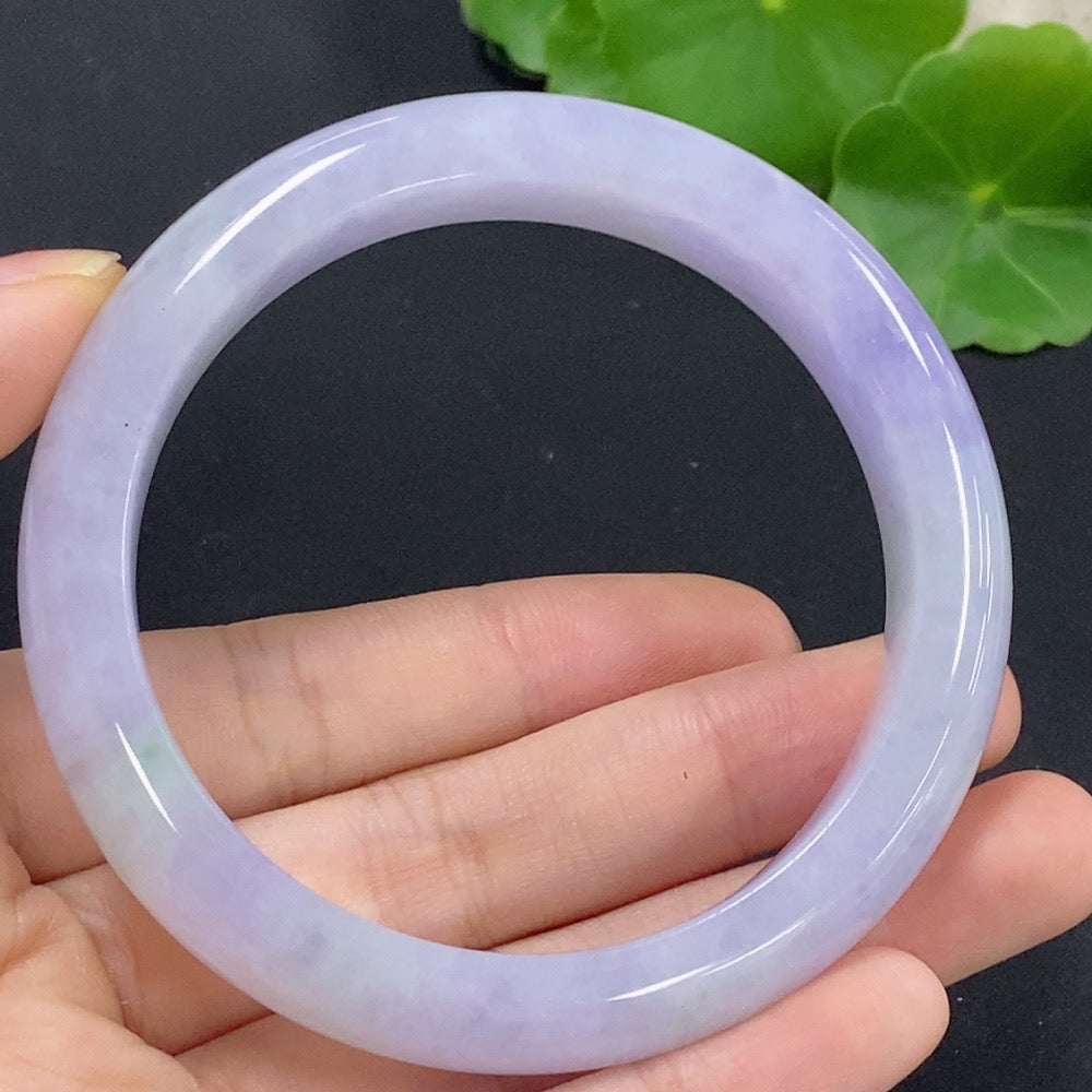 Jadeite round bangle in size 56.7mm, weighing approximately 58.98g, from HKHQ, featuring smooth, polished jade surface.
