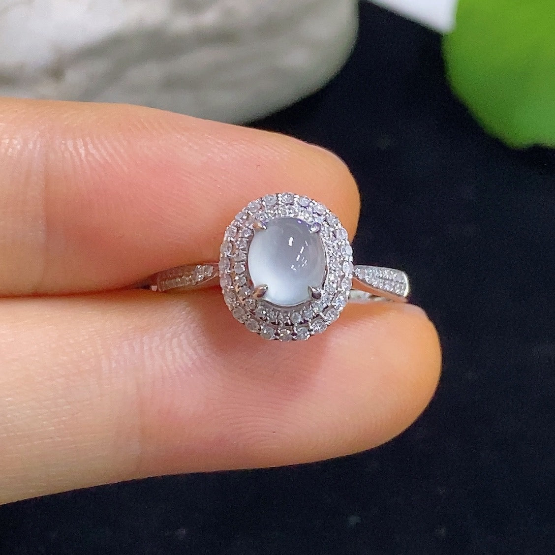 Jadeite cabochon solitaire ring with 18K gold band and diamond accents, elegant jewelry piece by HKHQ.