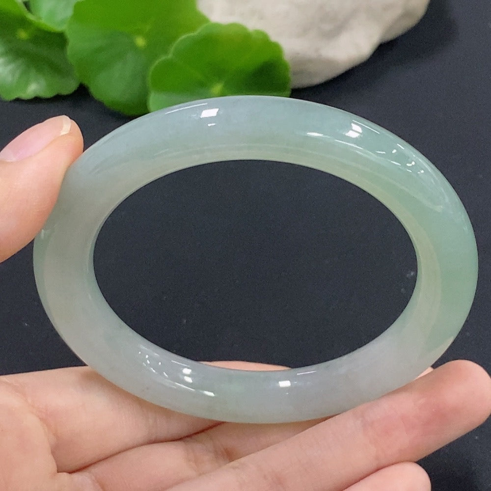 HKHQ jadeite round bangle size 56, smooth green jade with polished finish, weighs approximately 54.11g.