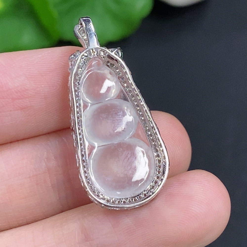 Jadeite lucky bean pendant with 18K gold details and diamond accents, crafted from high-quality jade, weighing around 3.3 grams.