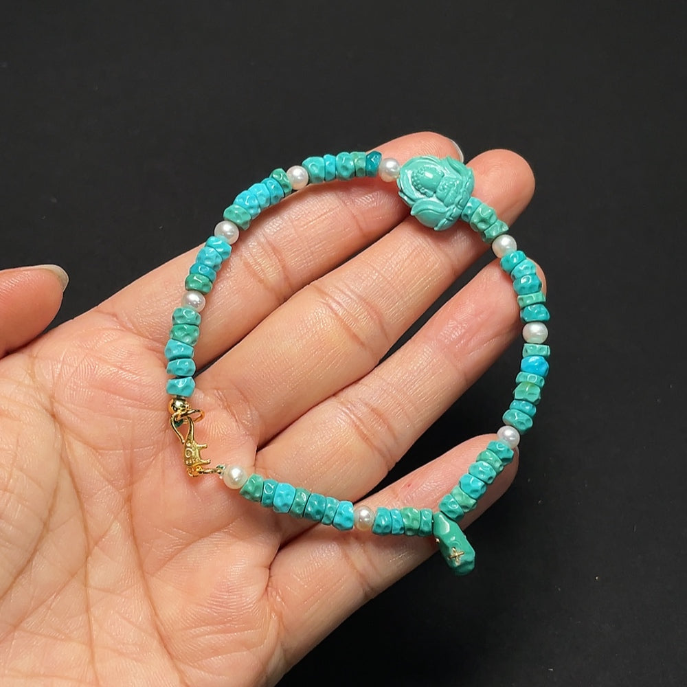 Turquoise bracelet with gold and pearl accents, featuring undetermined mineral components and natural stones in various sizes.