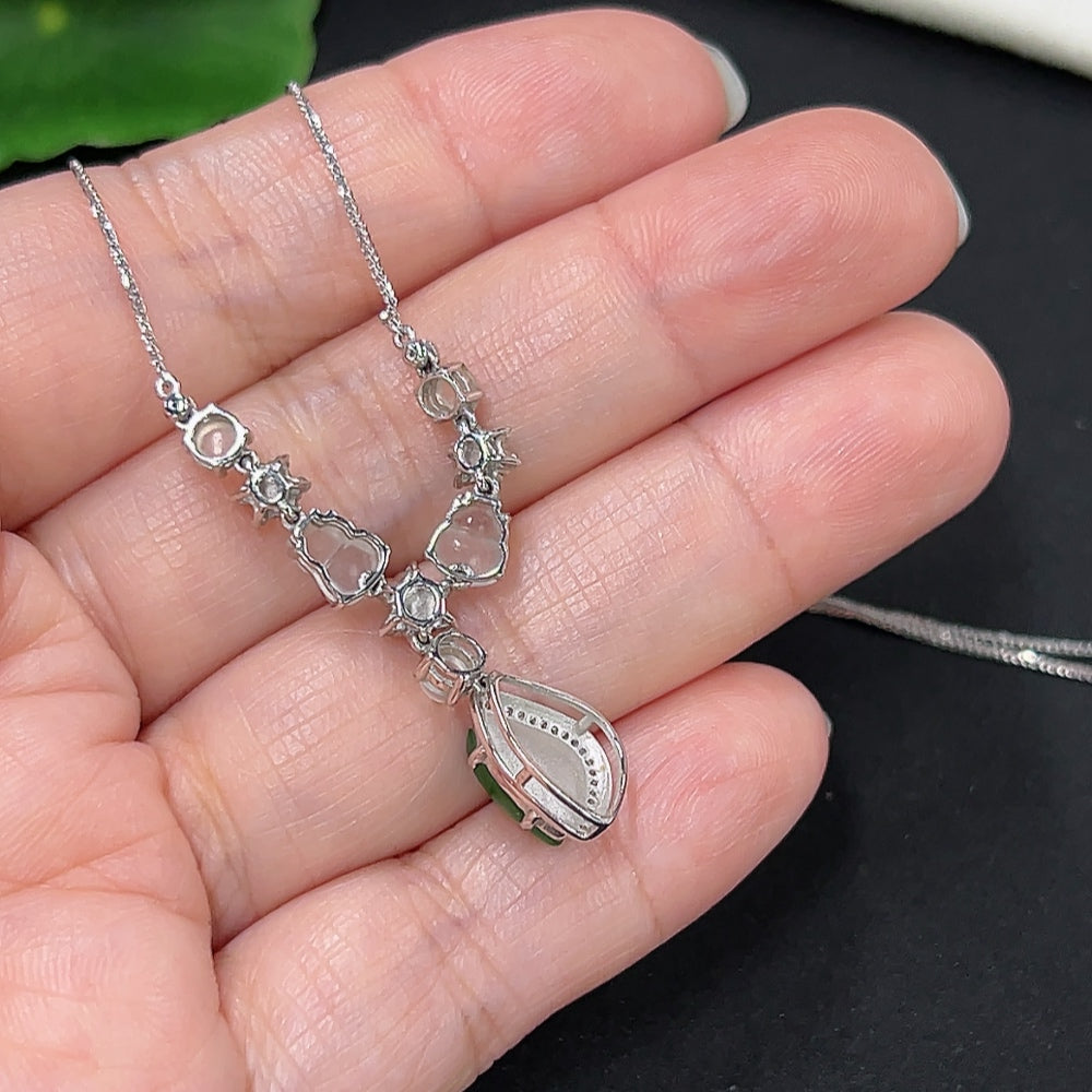 Jadeite necklace with diamond accents in 18K gold, HKHQ, showcasing smooth jade beads and sparkling diamond details.