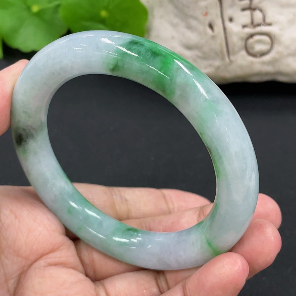Elegant jadeite round bangle from HKHQ featuring smooth, polished jade with a glossy finish and classic circular design.
