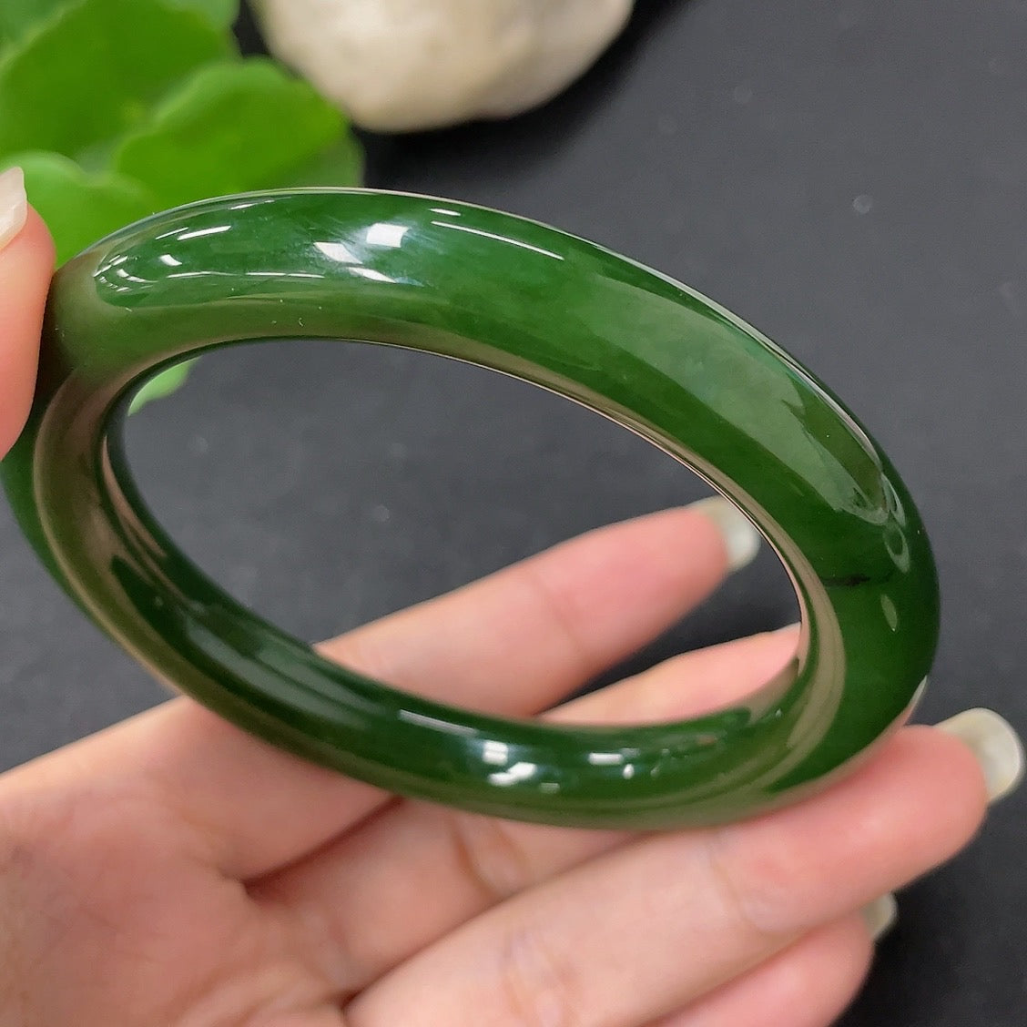 Green Hetian Jade round bangle with smooth surface, HKHQ brand, size 58.7, approximately 56.9g weight, natural jade jewelry.
