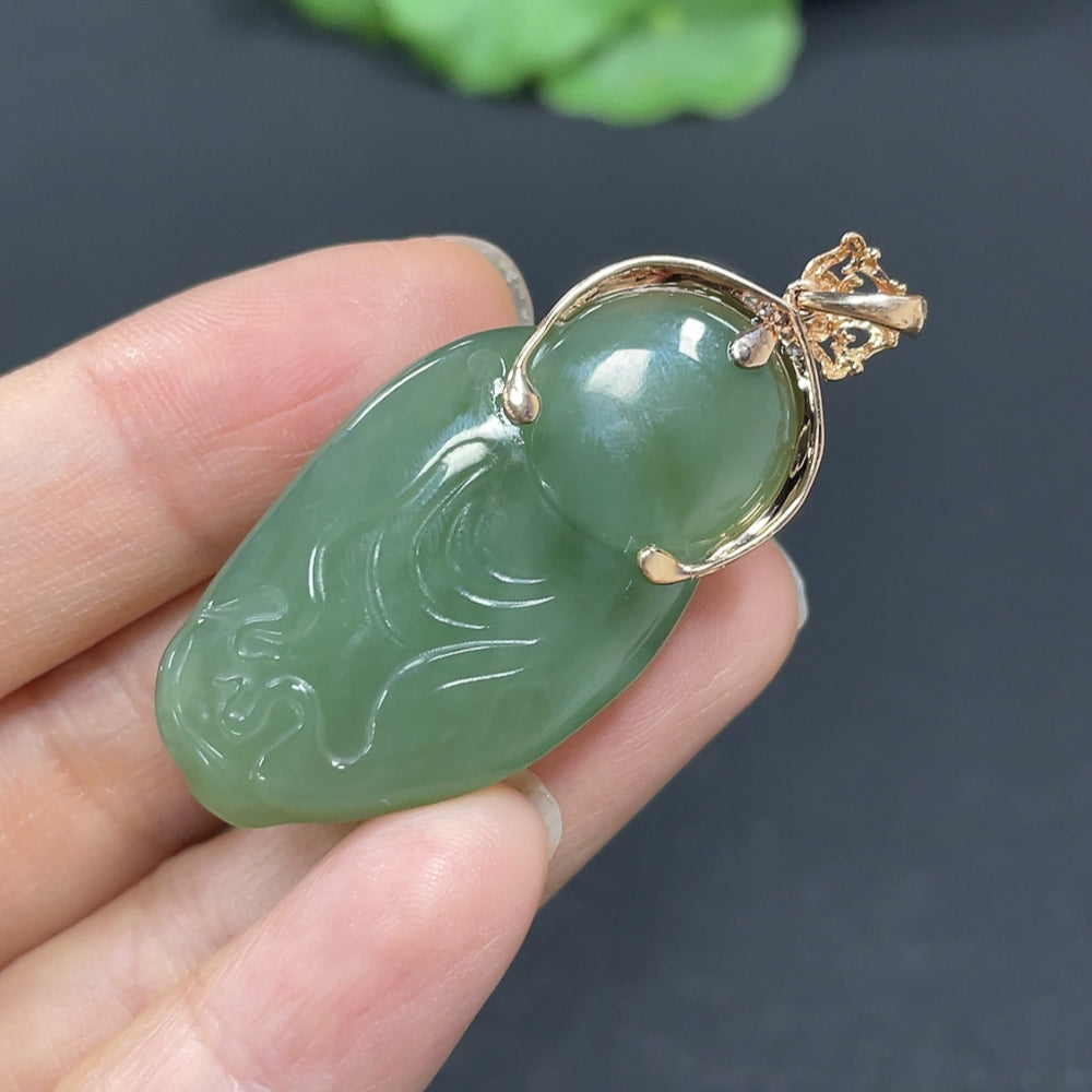 Hetian jade Buddha pendant with 18K gold inlay, accented with diamonds, weighing approximately 13.7g, from HKHQ.