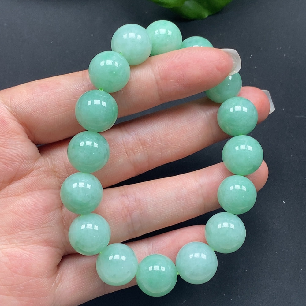 HKHQ jadeite bracelet with 12.8-inch size and 57.85g weight, showcasing smooth, polished jadeite beads.