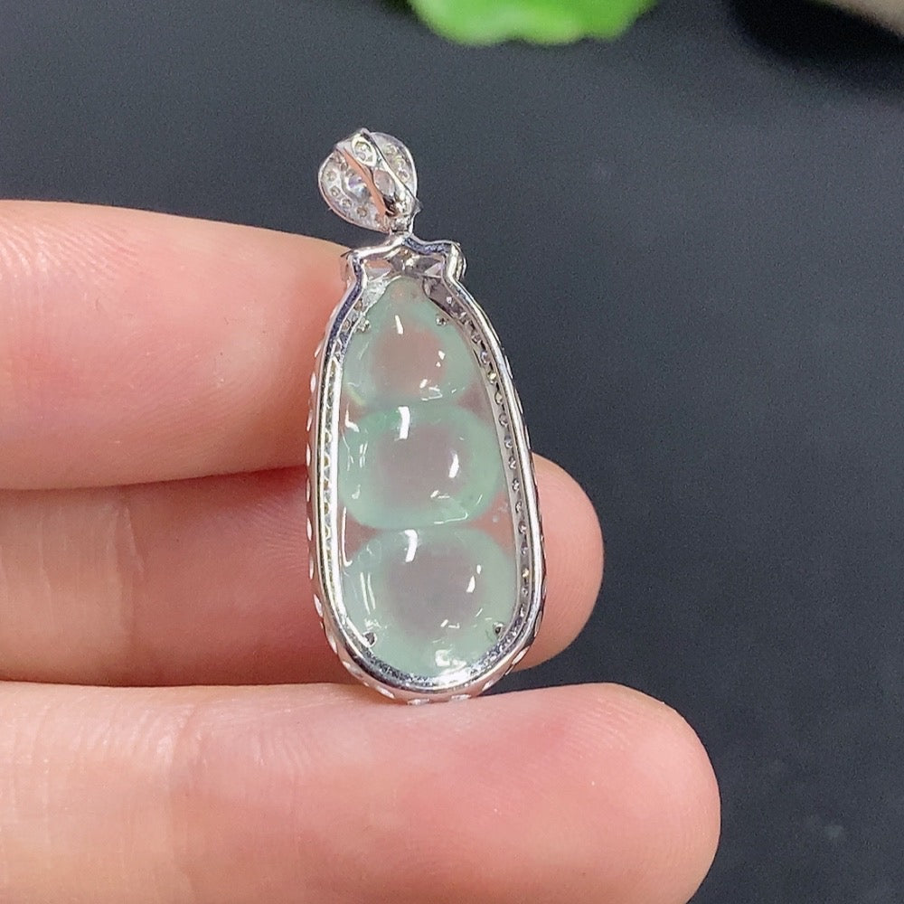 Jadeite lucky bean pendant inlaid with 18k gold, weighing approximately 2.68g, from HKHQ featuring intricate jade craftsmanship.