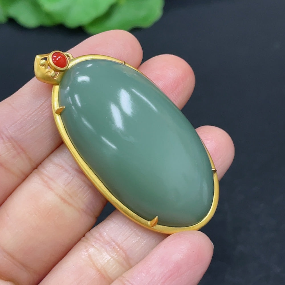 Hetian jade cabochon pendant necklace in 18K gold with beads, crafted by HKHQ, showcasing a smooth green jade stone.