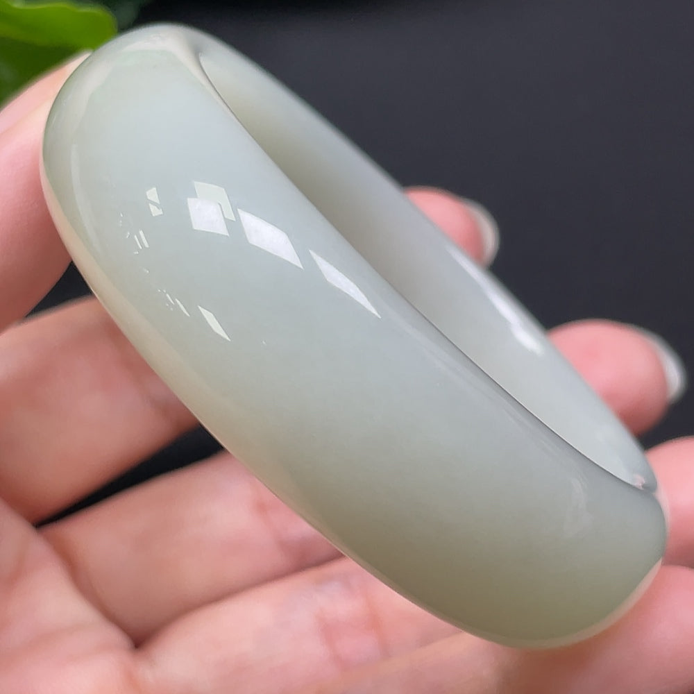 Hetian jade round bracelet from HKHQ, size 52mm, weighing approximately 60.95g, featuring smooth polished jade beads.