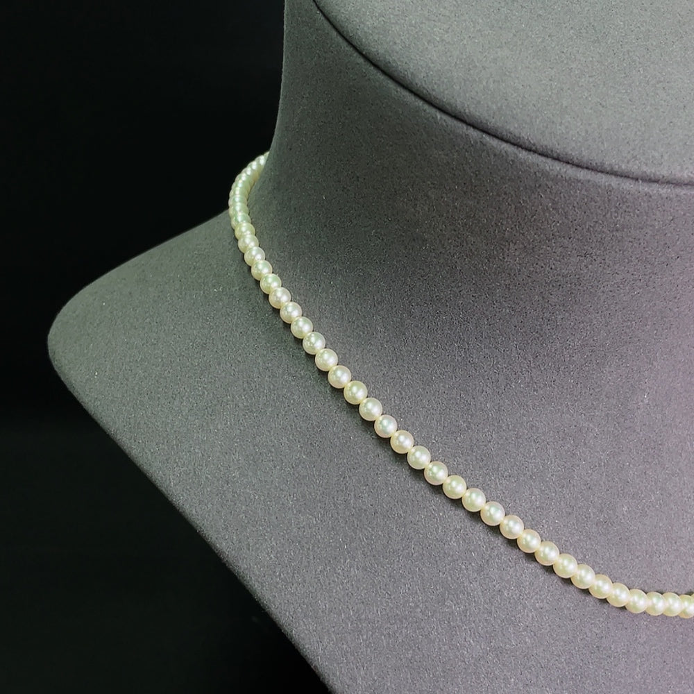 Seawater pearl strand by HKHQ featuring 4-4.4mm non-gold pearls, totaling approximately 12.04 grams.