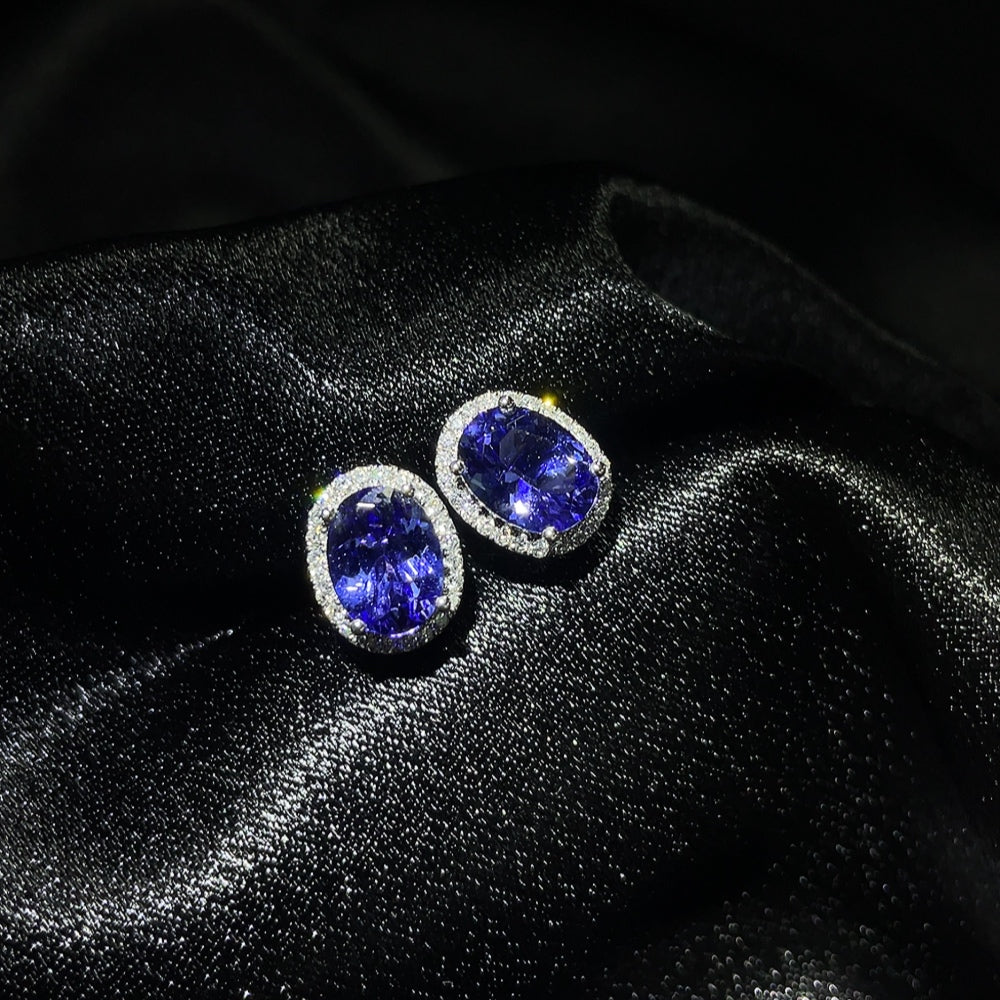Elegant 18K Tanzanite gemstone earrings with a total weight of approximately 2.25g, showcasing vibrant blue-purple stones.