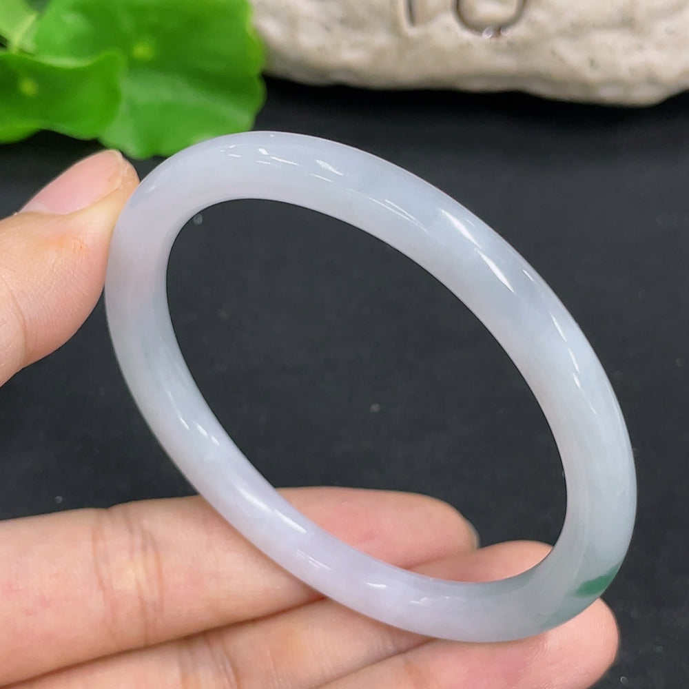 Jadeite Concubine Bracelet from HKHQ featuring smooth, polished jadeite beads on a delicate string, showcasing elegant craftsmanship.