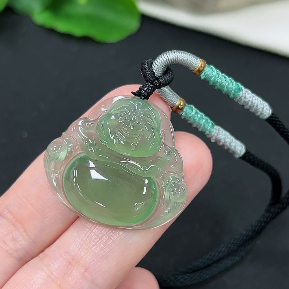 Jadeite Buddha pendant from HKHQ, featuring a detailed Buddha figure on a rope, weighing approximately 9.2g.