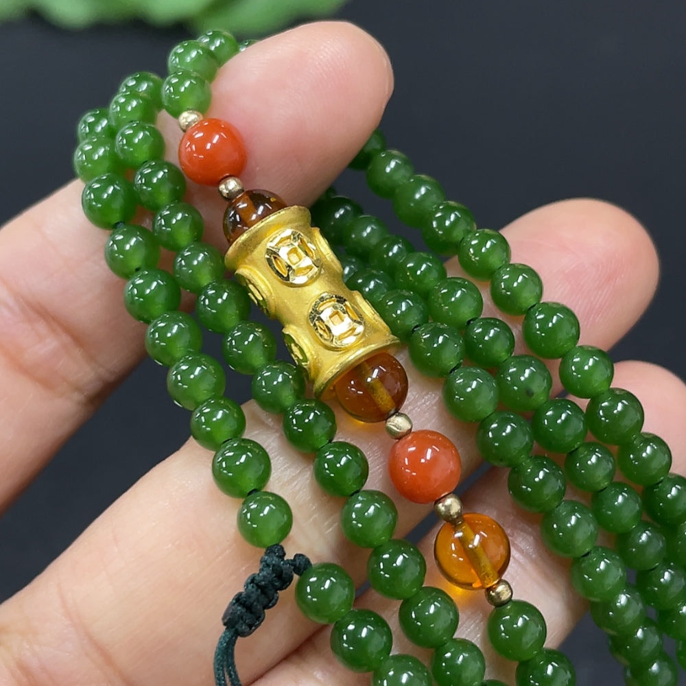 Hetian Jade beaded necklace featuring smooth, round jade beads with a traditional design, crafted by HKHQ.