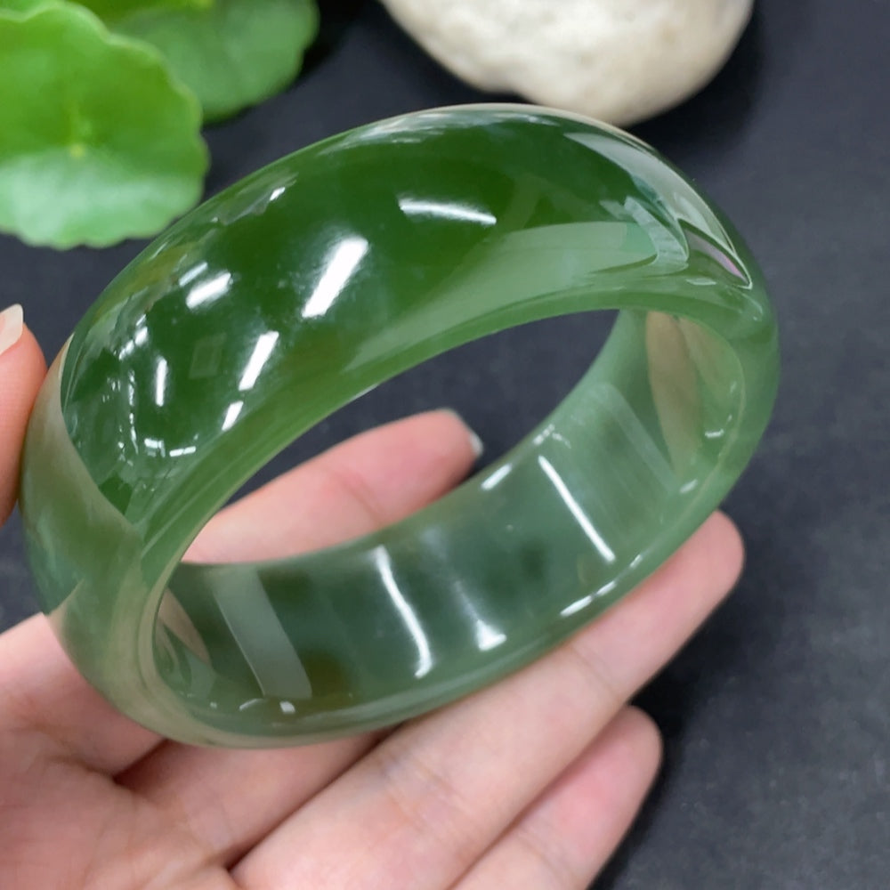 Green Hetian Jade round bracelet with HKHQ branding, measuring 58.9mm and weighing approximately 96.6g.