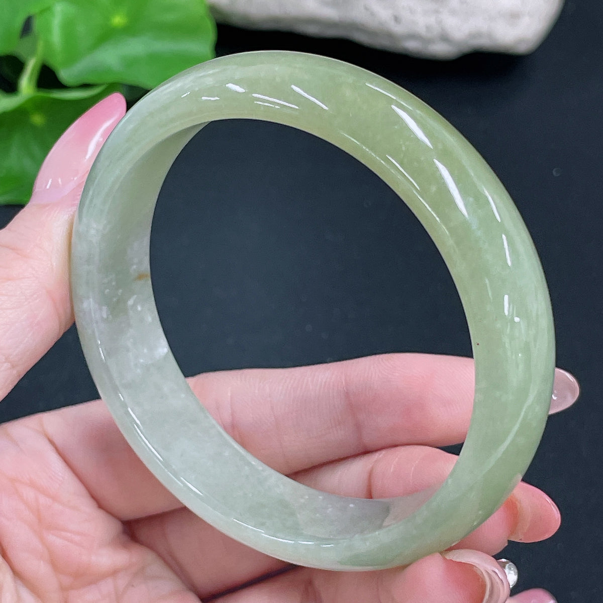 HKHQ jadeite round bracelet weighing 51.42g with a size of 56.8mm, featuring smooth, polished jadeite beads.