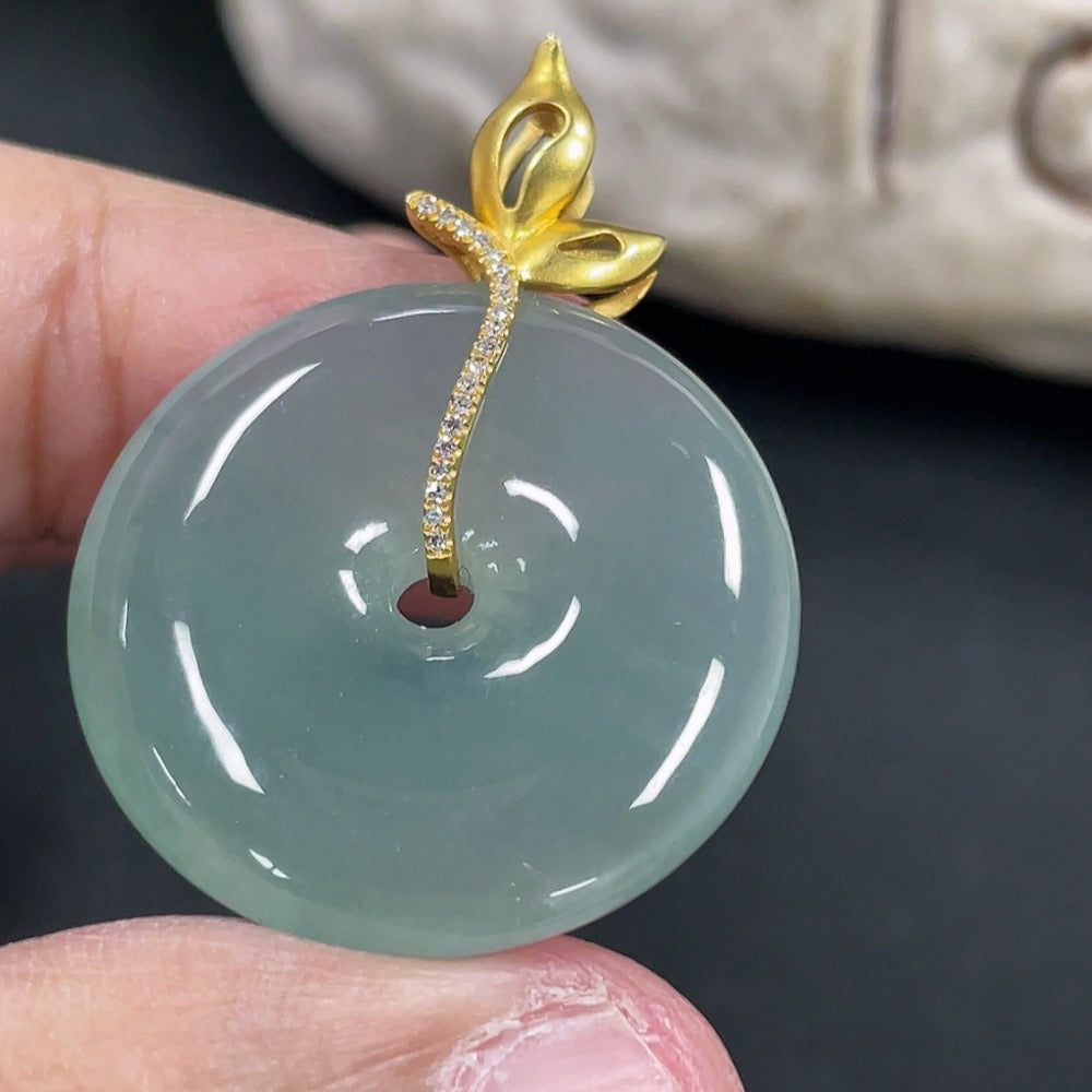 Jadeite safety buckle pendant necklace with 18K gold clasp and diamond accents, featuring a smooth jadeite pendant on a delicate chain.