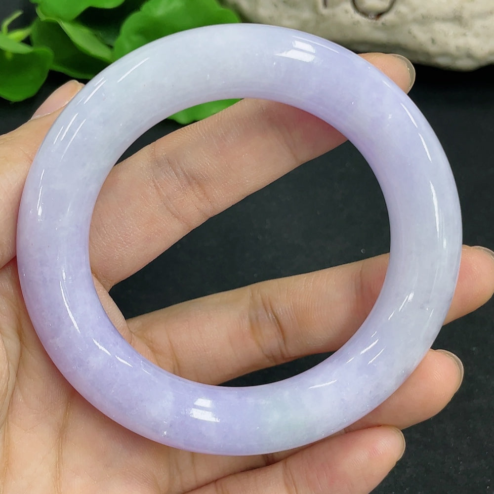 Jadeite round bangle by HKHQ, size 52.4, with smooth polished surface and a total weight of approximately 75.76 grams.