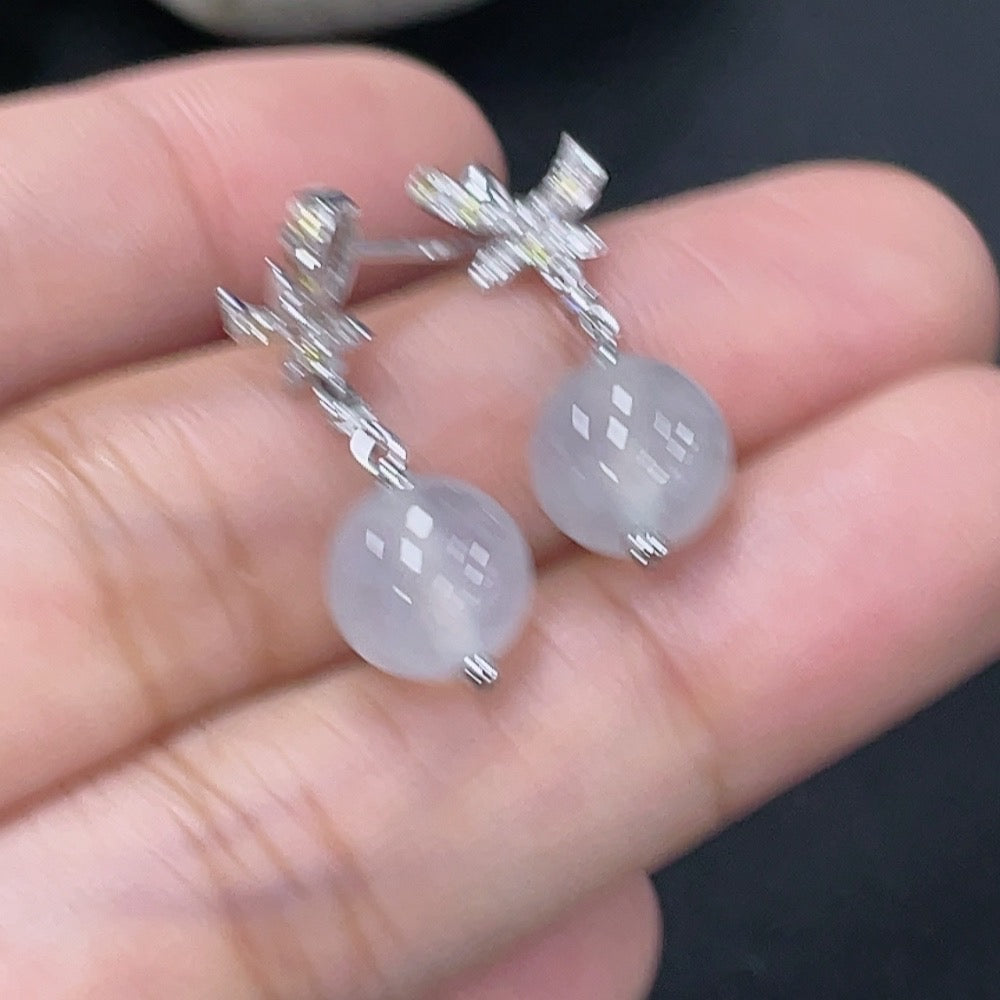 Jadeite earrings set in 18k gold with diamond accents, total product weight approximately 3.07g