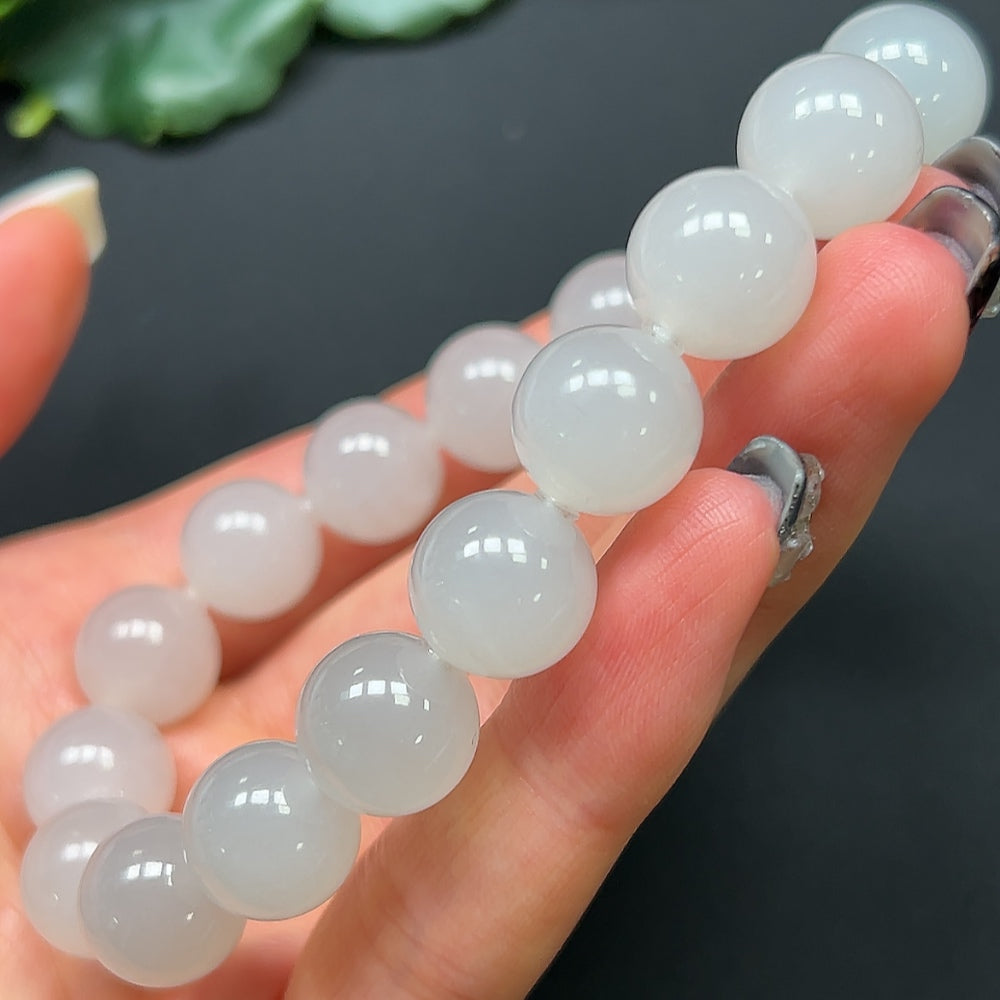 HKHQ Hetian Jade bracelet with 11.9mm beads, weighing approximately 44.52g, featuring smooth, polished jade stones.