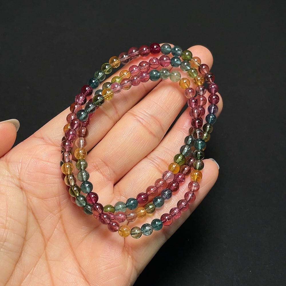 Tourmaline gemstone bead strand with visible organic matter, 4.3mm size, HKHQ brand, weighs approx. 19g, natural gemstone jewelry.