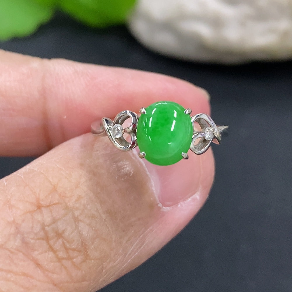 Jadeite cabochon ring with 18k gold setting, size 11.5, featuring a smooth green jade stone on a delicate gold band.