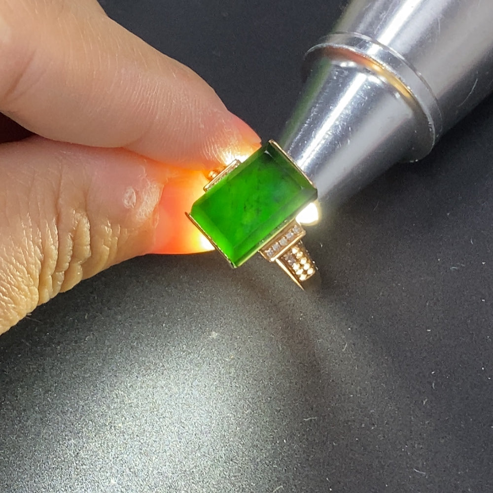 Jadeite ring with diamond accents in 18K gold, size 14, weighing approximately 3.4g, featuring a polished gemstone setting.