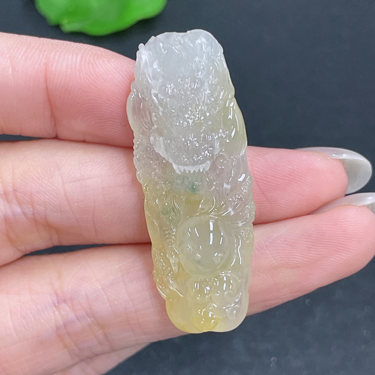 Jadeite pendant featuring a dragon plaque with intricate carving, weighing approximately 10g, crafted by HKHQ.
